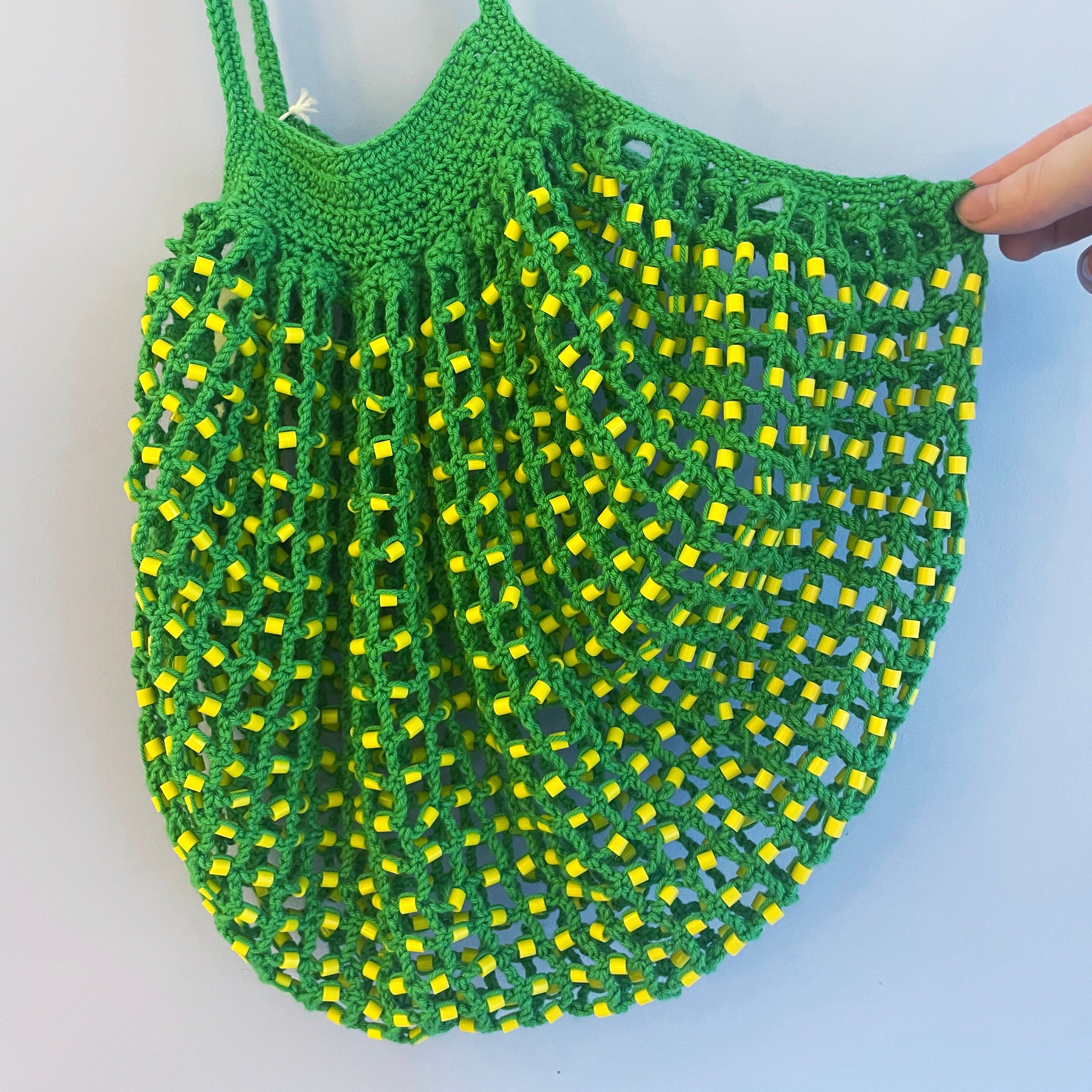 Green tote bag with yellow beads