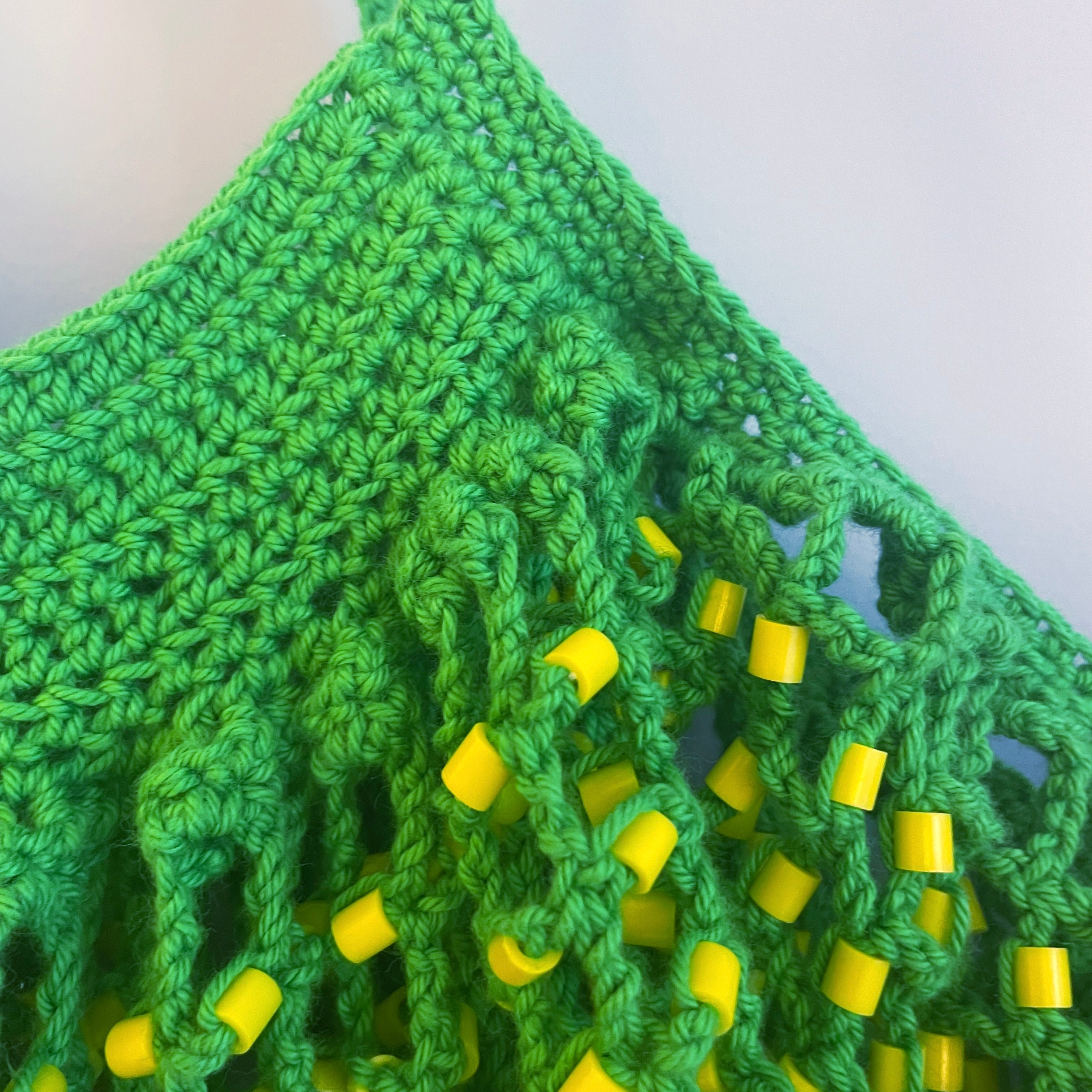 Green tote bag with yellow beads